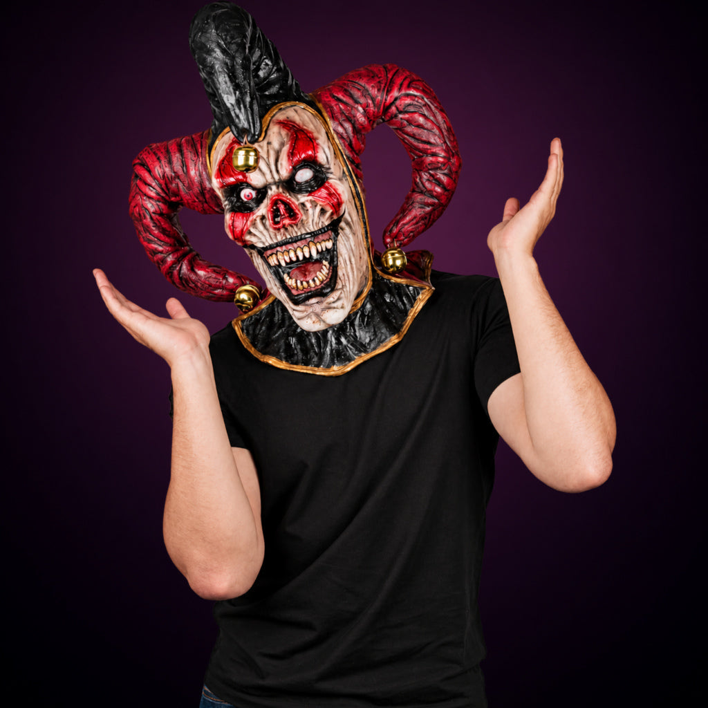 Evil Jester mask, view 8, against a smooth dark plum-charcoal gradient background