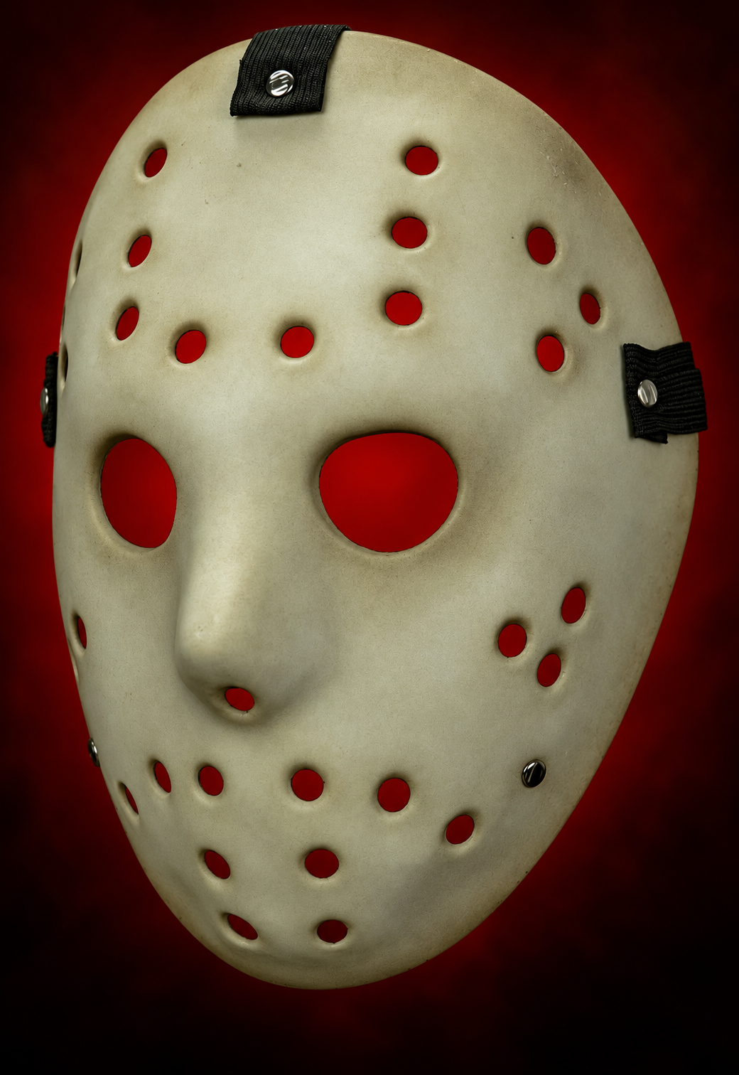 Killer Goalie Antique Mabry Monsters hockey mask, left-facing angled view with red gradient visible through openings