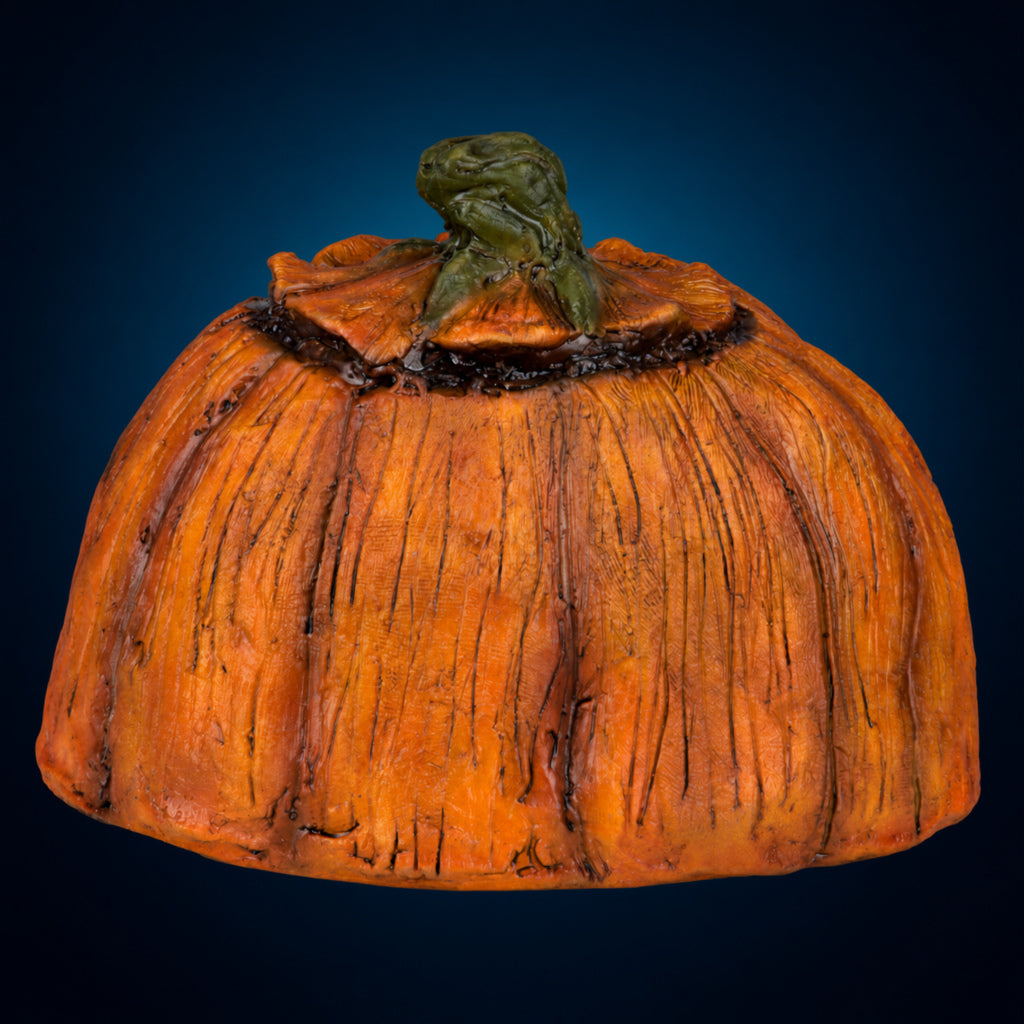 Rotten Pumpkin 2 – rear view on dark blue-teal gradient