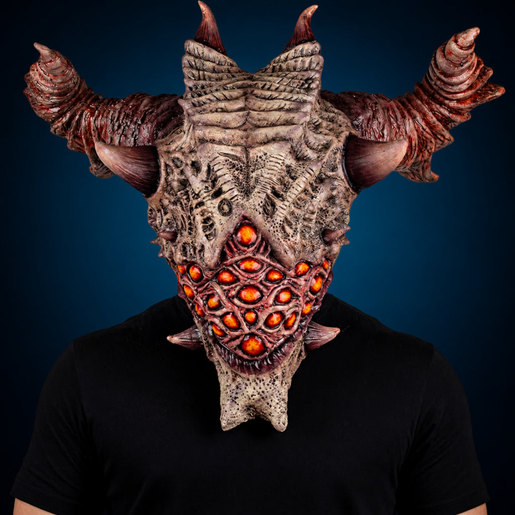 Aurixis mask, view 2, against a smooth dark blue-teal gradient background