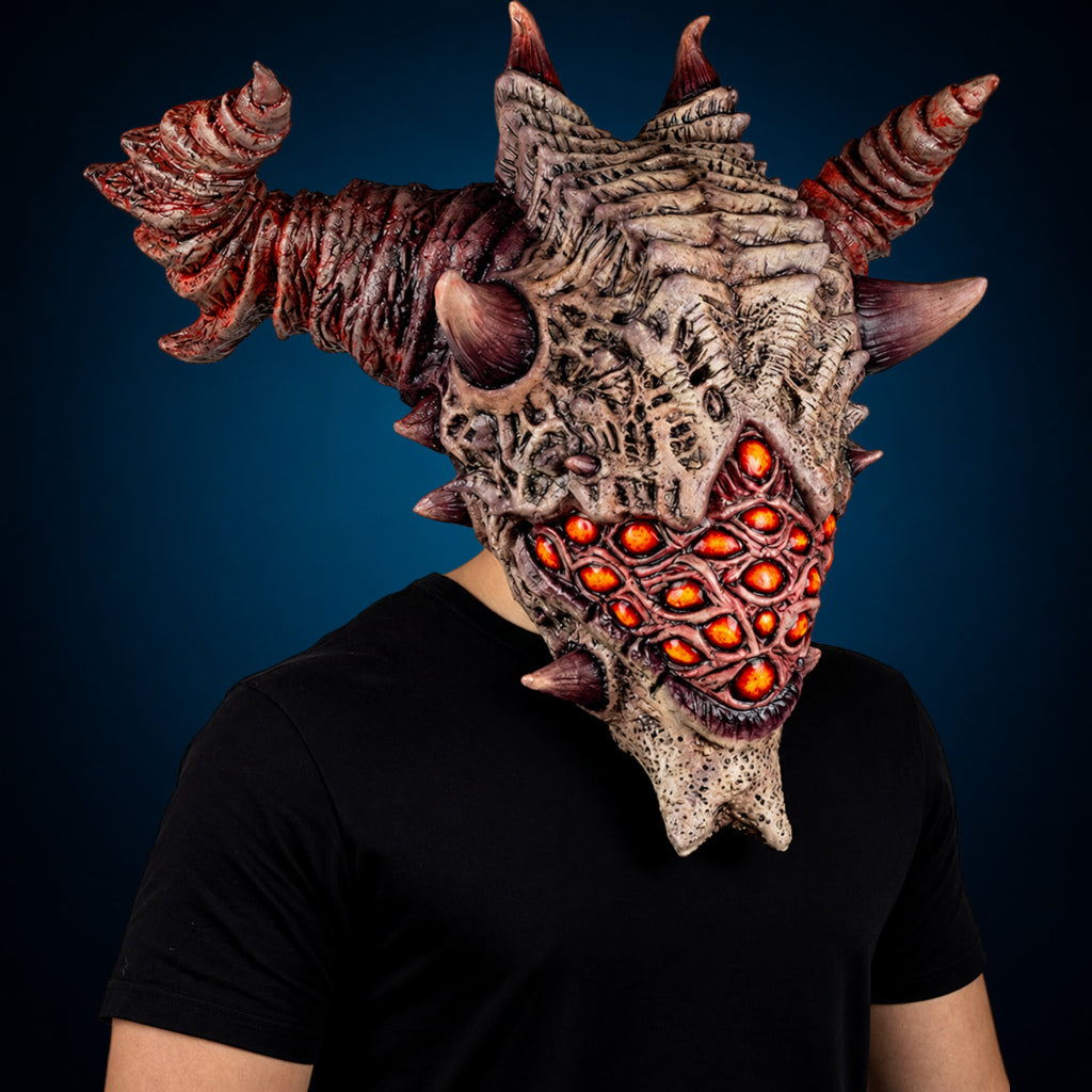 Aurixis mask, view 3, against a smooth dark blue-teal gradient background