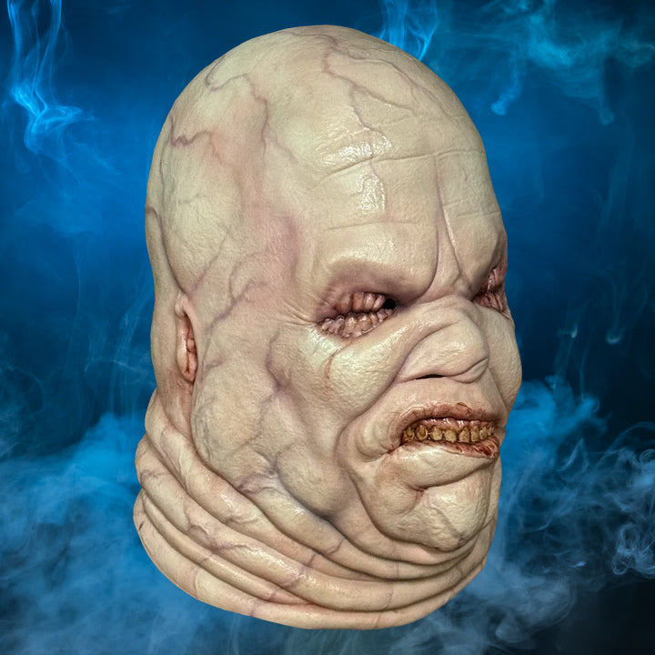 Butterball Hellraiser mask – view 1 with blue smoke background matching the original hero image