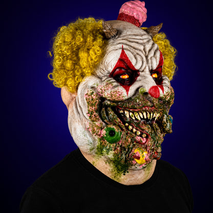 Charles Demon of Gluttony mask, view 3, against a smooth dark indigo gradient background