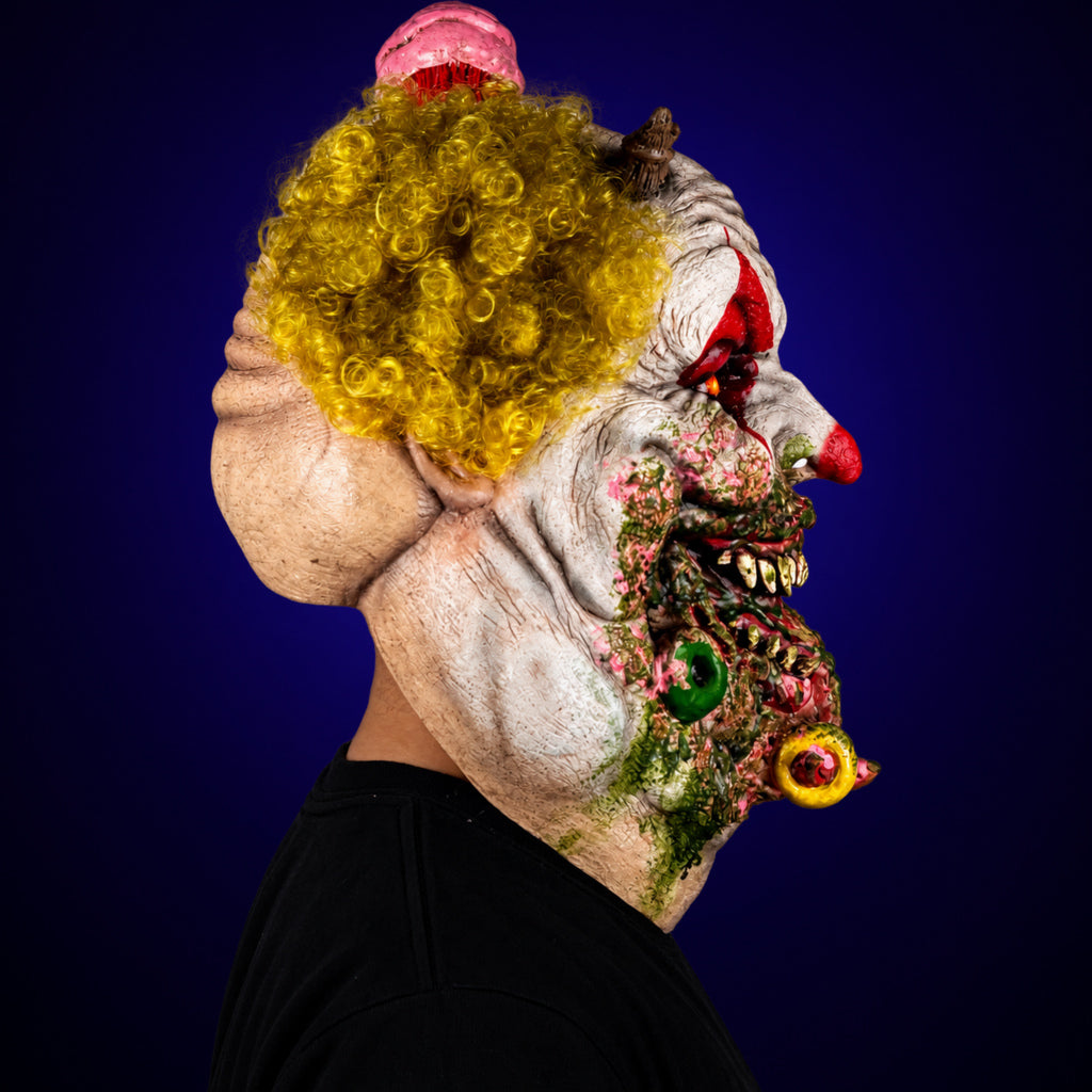 Charles Demon of Gluttony mask, view 4, against a smooth dark indigo gradient background