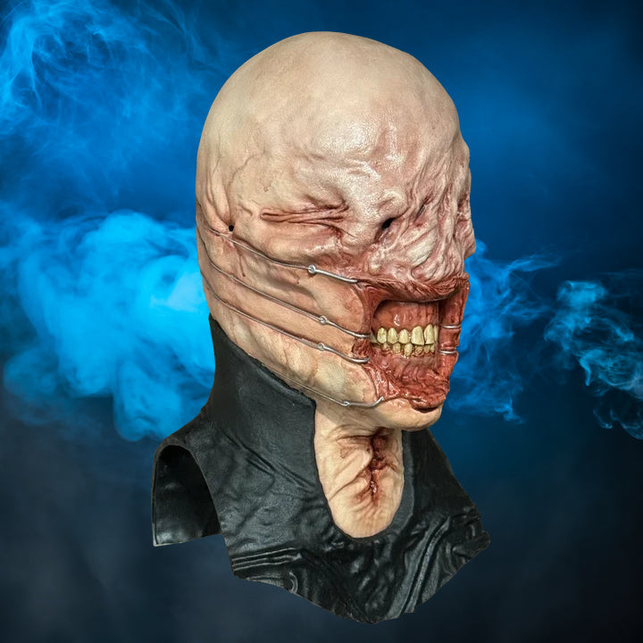 Chatterer Hellraiser mask – view 1 with blue smoke background matching the original hero image