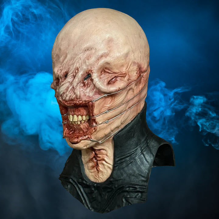 Chatterer Hellraiser mask – view 3 with blue smoke background matching the original hero image