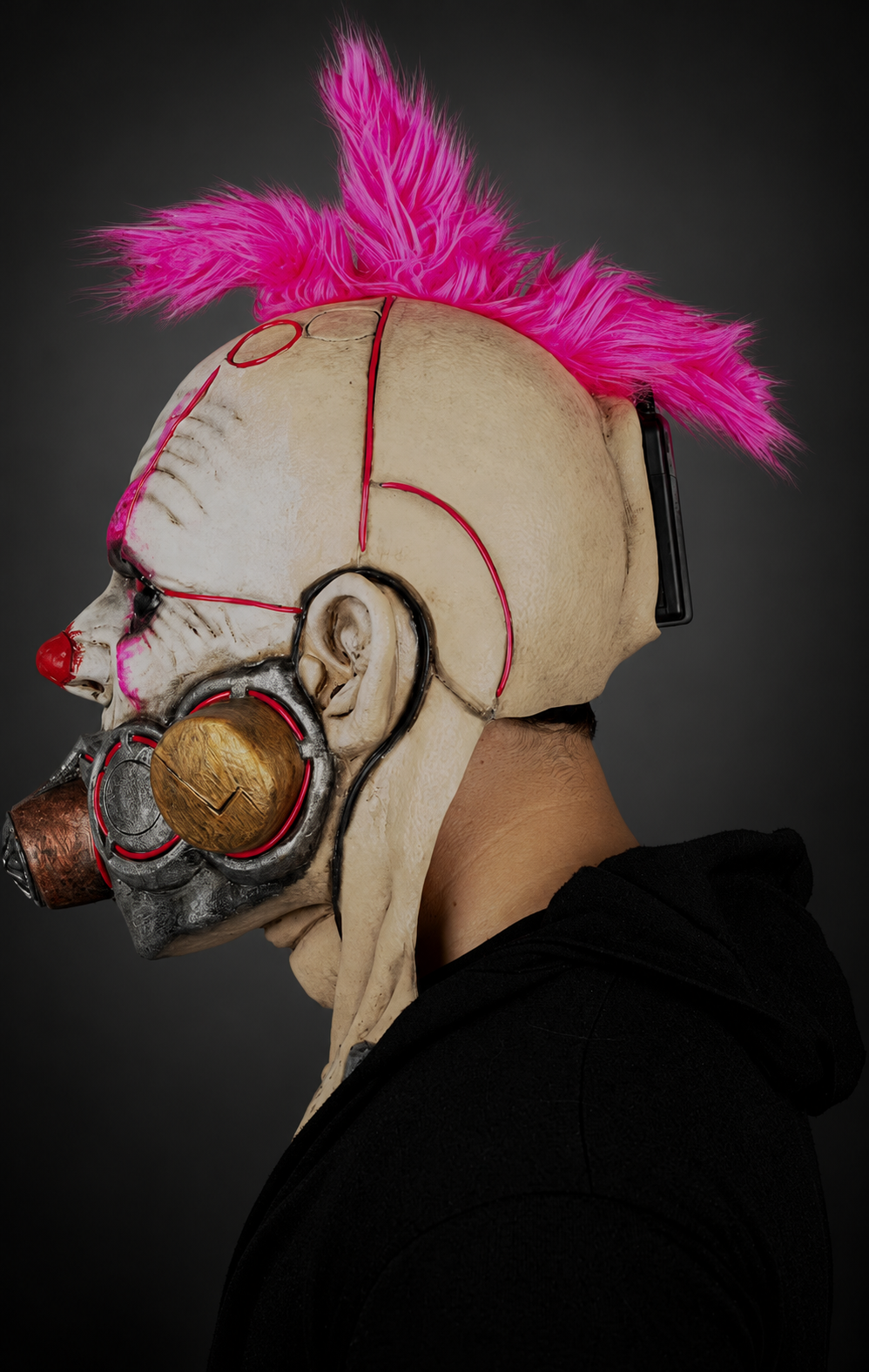 Clown Muzzle mask, left profile against smooth dark charcoal and grey gradient