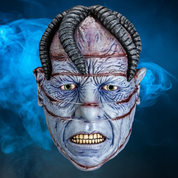 Dr. Channard Hellraiser mask – view 4 with blue smoke background matching the original hero image