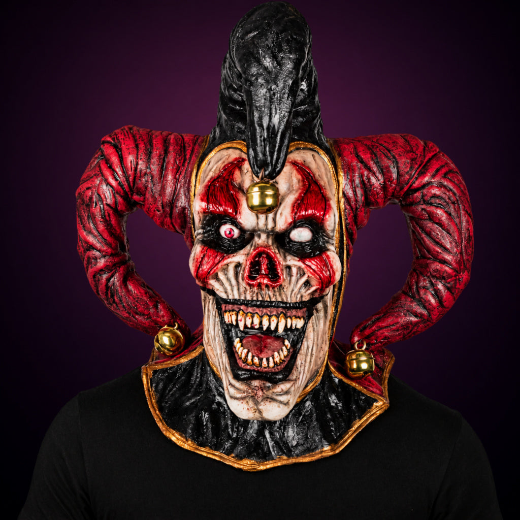 Evil Jester mask, view 2, against a smooth dark plum-charcoal gradient background
