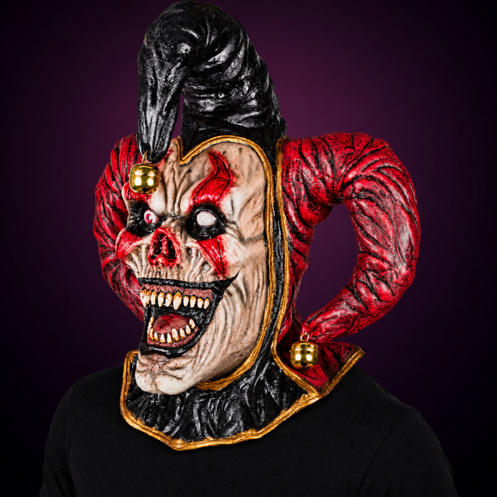 Evil Jester mask, view 7, against a smooth dark plum-charcoal gradient background