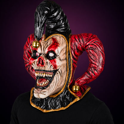 Evil Jester mask, view 7, against a smooth dark plum-charcoal gradient background