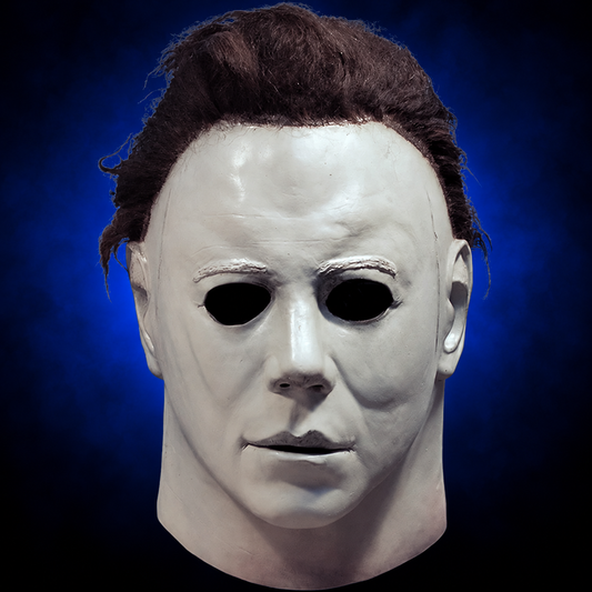 Halloween (1978) Michael Myers mask, front view against dark blue radiant background