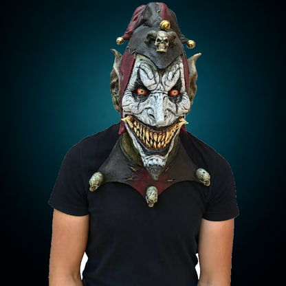 Jesterblin mask, view 3, against consistent dark petrol teal gradient
