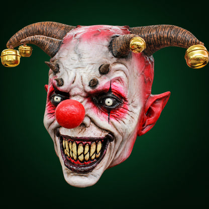 Jingle Jangle mask, view 2, against a smooth dark evergreen gradient background