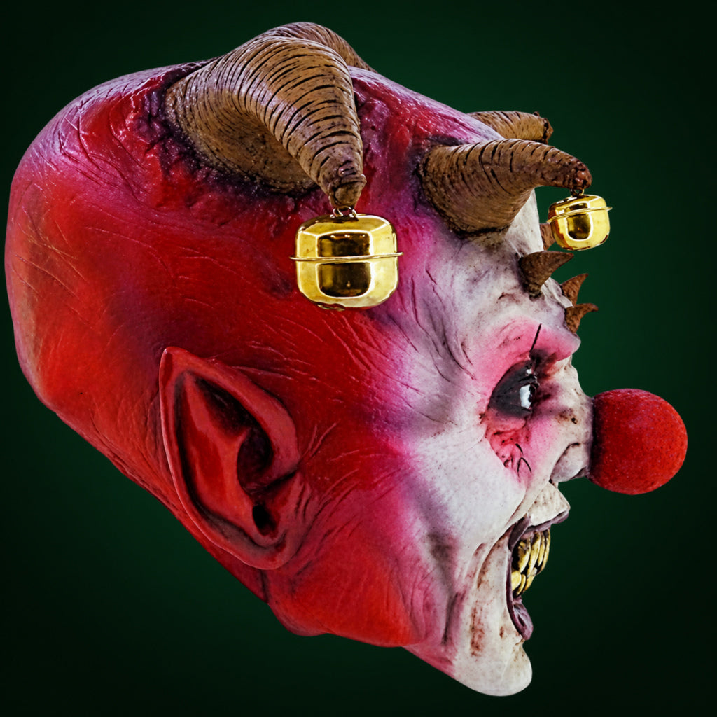 Jingle Jangle mask, view 4, against a smooth dark evergreen gradient background