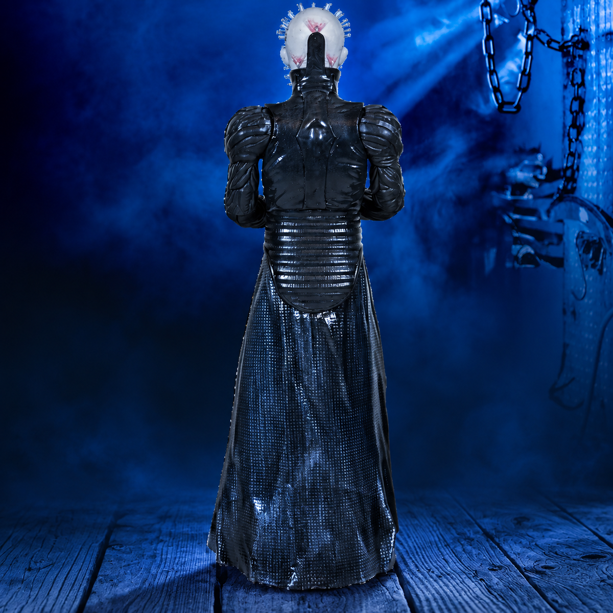Pinhead 8-inch Hellraiser figure, rear view against a blue industrial background