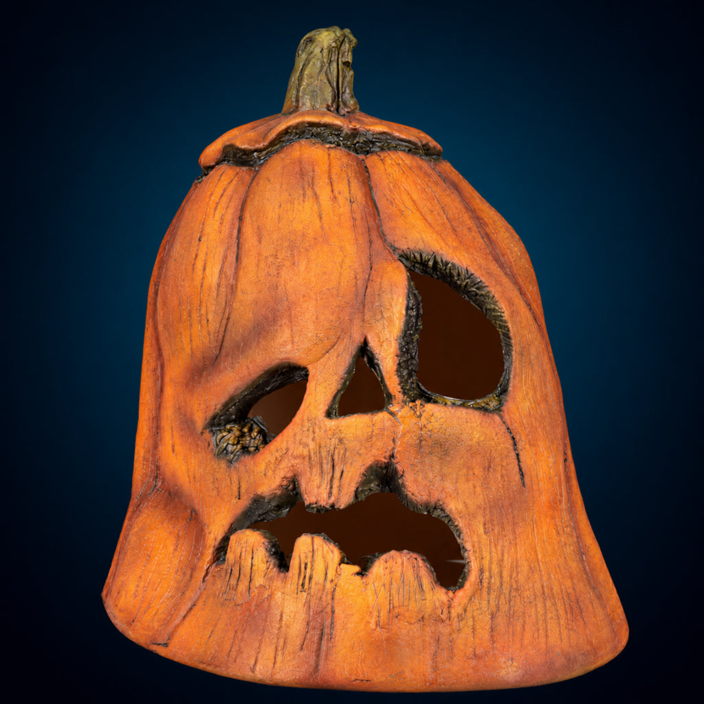 Rotten Pumpkin 1 decoration, view 1, against a smooth dark blue-teal gradient background