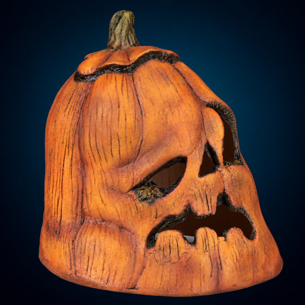 Rotten Pumpkin 1 decoration, view 2, against a smooth dark blue-teal gradient background