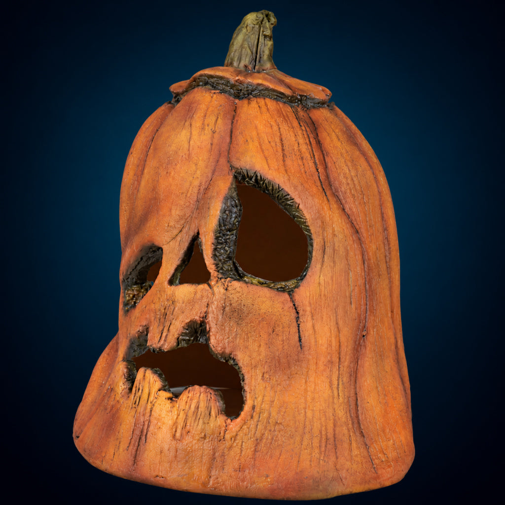 Rotten Pumpkin 1 decoration, view 3, against a smooth dark blue-teal gradient background