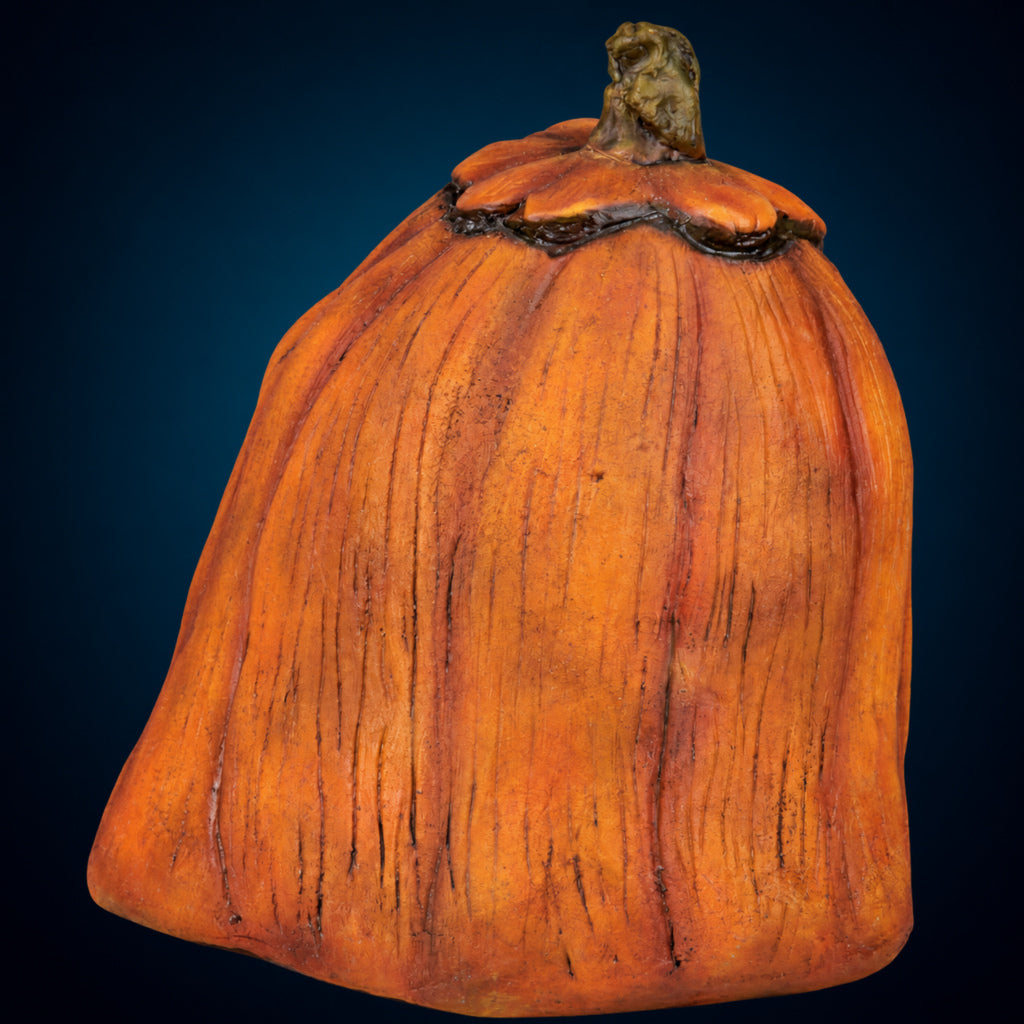 Rotten Pumpkin 1 decoration, view 4, against a smooth dark blue-teal gradient background
