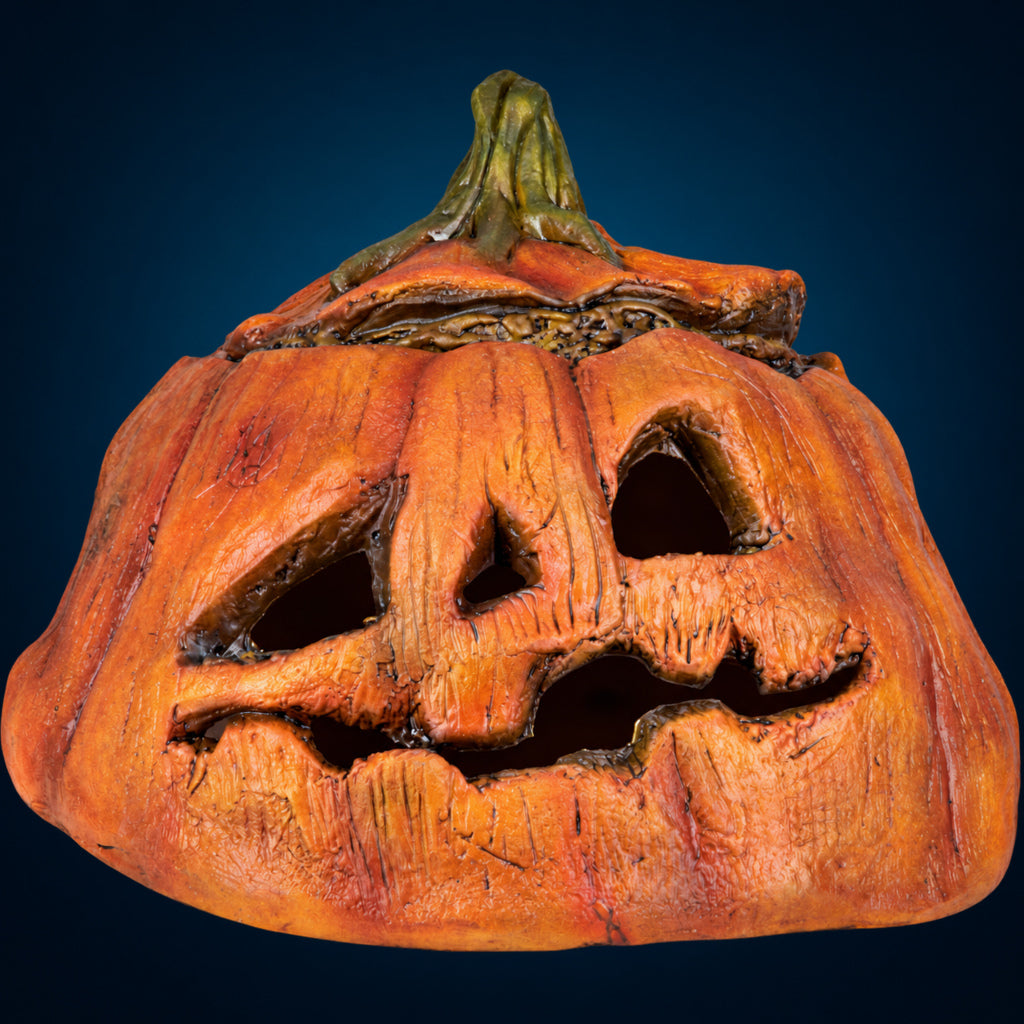 Rotten Pumpkin 3 decoration, view 1, against a smooth dark blue-teal gradient background