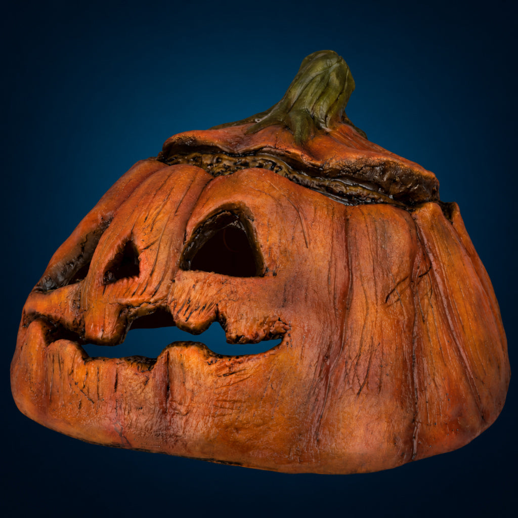 Rotten Pumpkin 3 decoration, view 2, against a smooth dark blue-teal gradient background