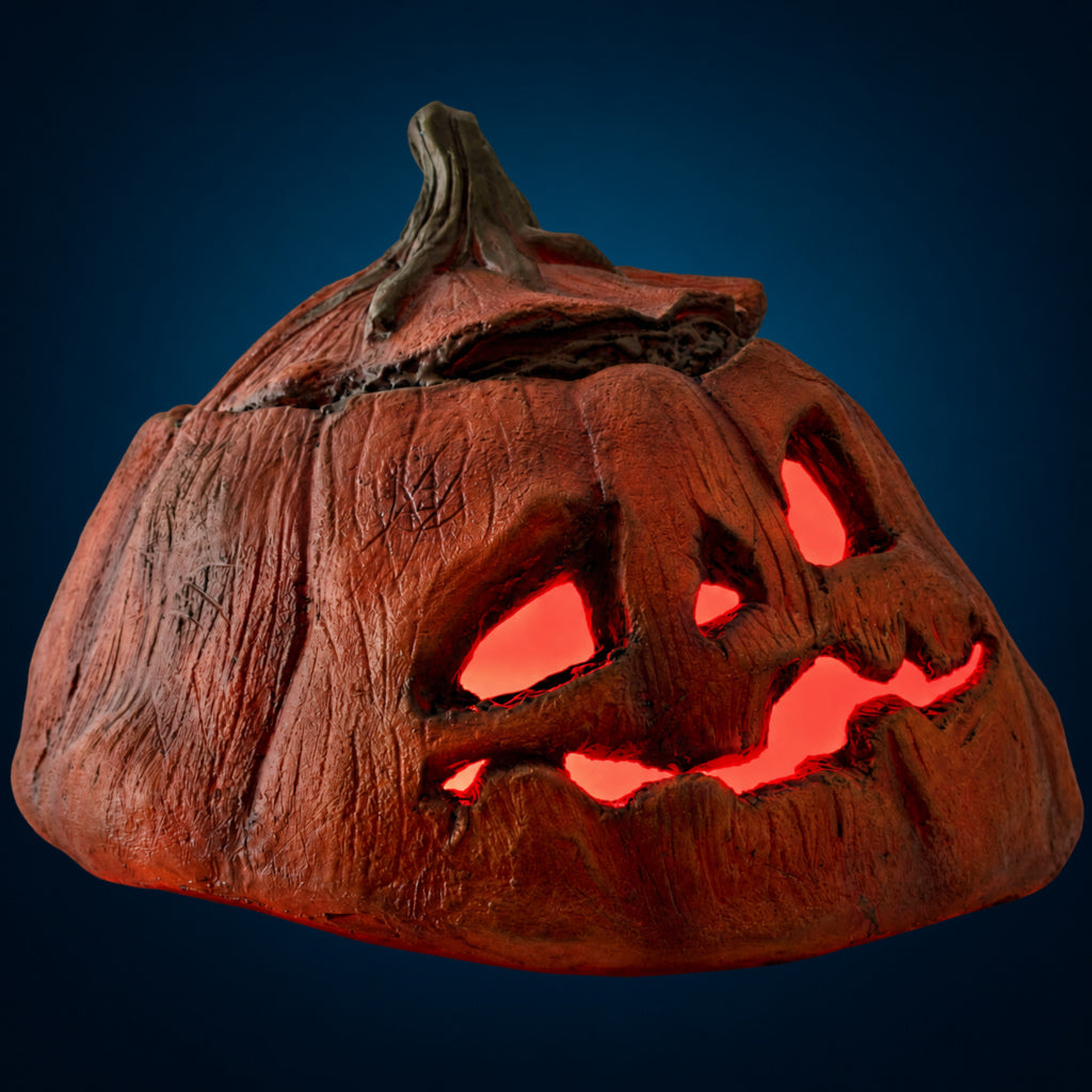 Rotten Pumpkin 3 decoration, view 4, against a smooth dark blue-teal gradient background