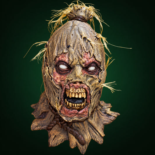 Scareborn mask, view 1, against a smooth dark forest-green gradient background