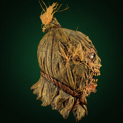 Scareborn mask, view 4, against a smooth dark forest-green gradient background