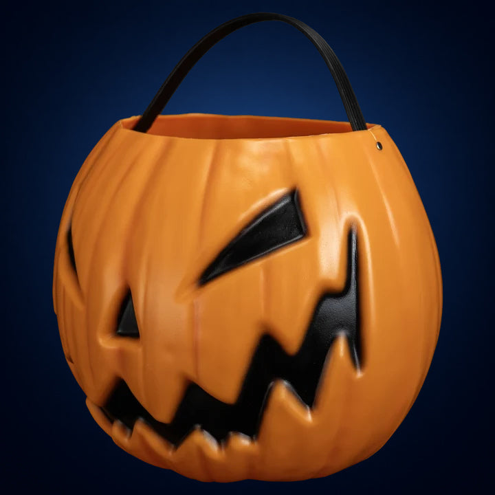 Sleepy Hollow Pumpkin candy pail – opposite angled front view on midnight-blue gradient