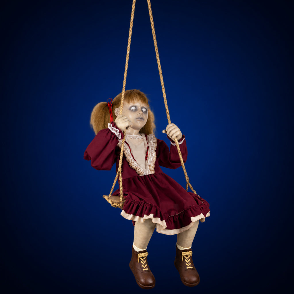 Swinging Ghostly Girl decoration, view 1, against a smooth dark midnight-blue gradient background
