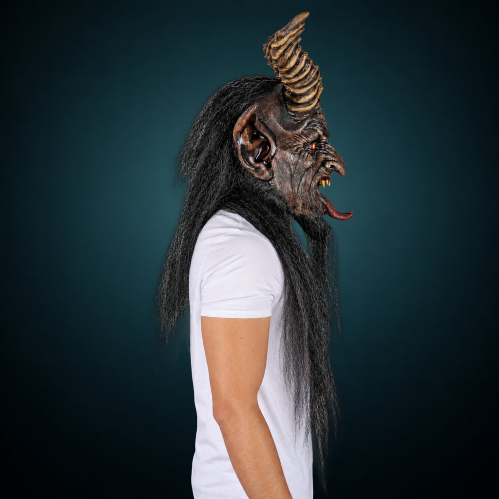 The Krampen mask, view 4, against a smooth dark slate-teal gradient background
