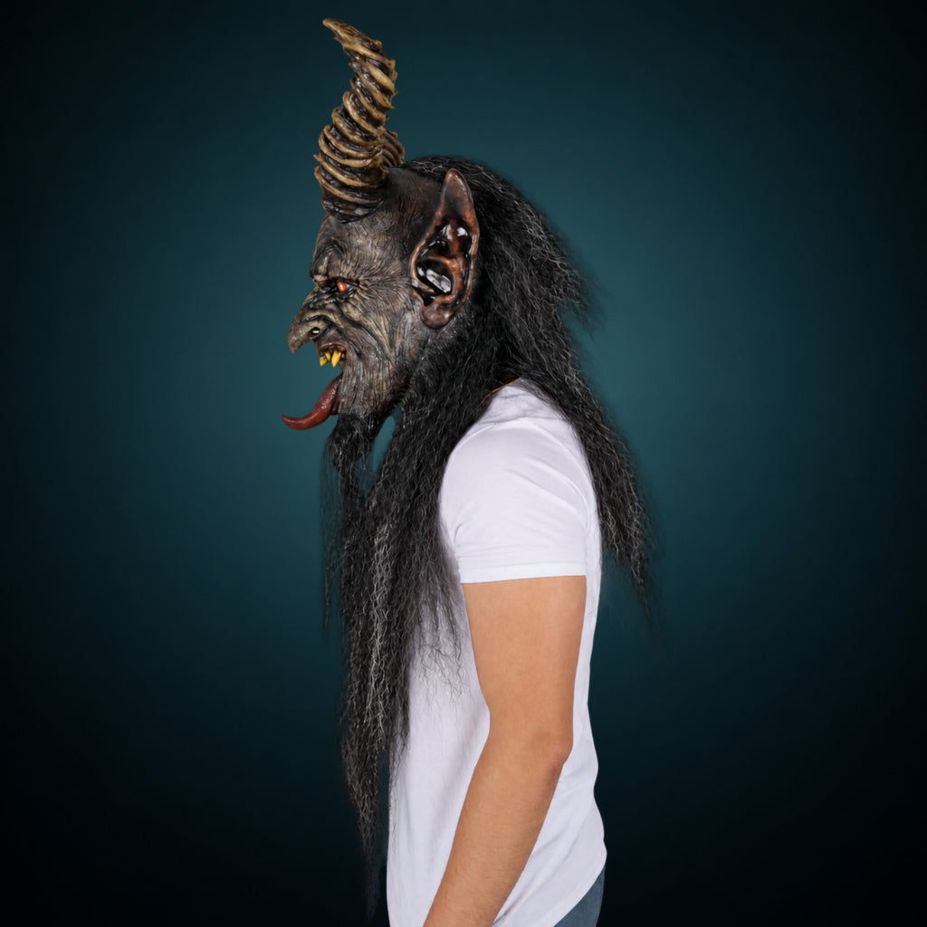 The Krampen mask, view 6, against a smooth dark slate-teal gradient background