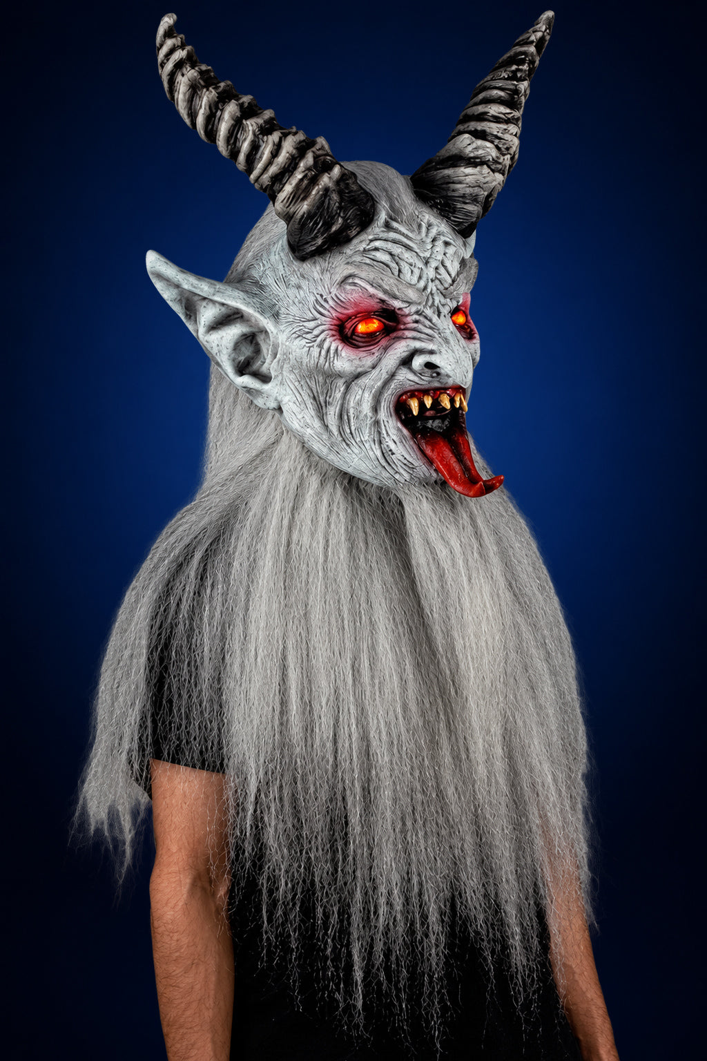 Winter Krampen mask, view 2, against a smooth dark midnight-blue gradient background