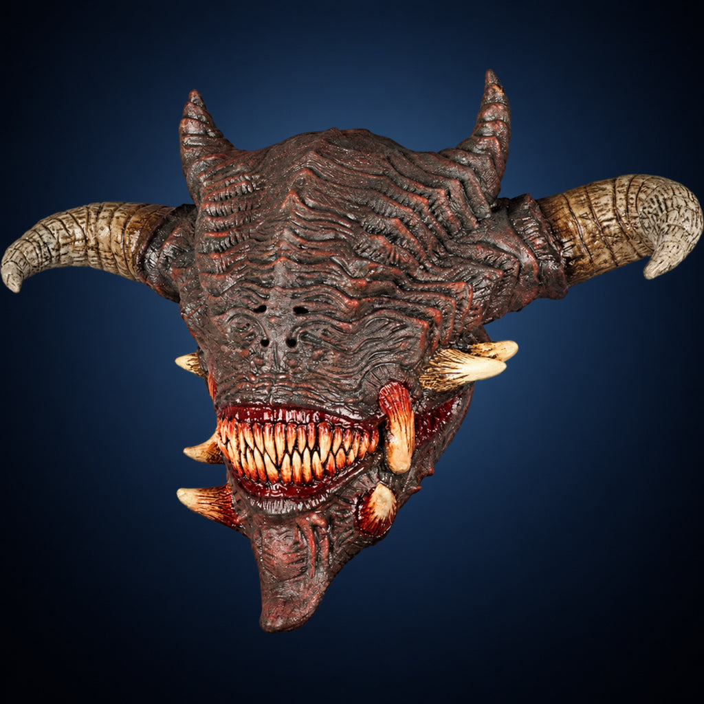 Wrath mask, view 1, against a smooth dark steel-blue gradient background