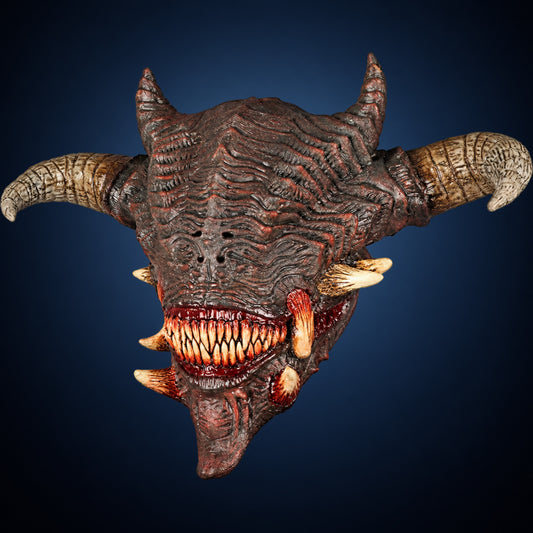 Wrath mask, view 1, against a smooth dark steel-blue gradient background