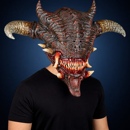 Wrath mask, view 3, against a smooth dark steel-blue gradient background