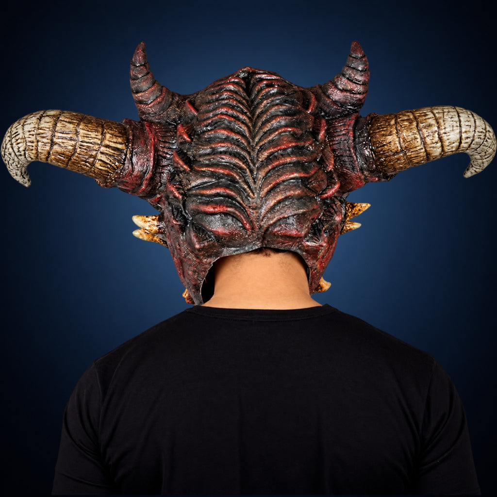 Wrath mask, view 5, against a smooth dark steel-blue gradient background